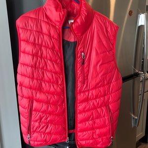 All red vest…the size is medium but I wear large in most shirts and this fits